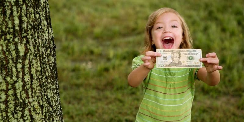 earn money as kid little girl holding money