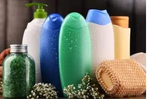 Bottles of shampoo and lotions. Use up what you already have to save money and live more frugal